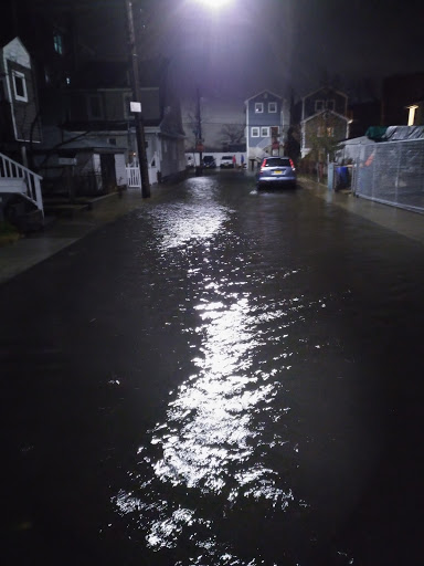 a car driving down a wet street (MyCoast AI)