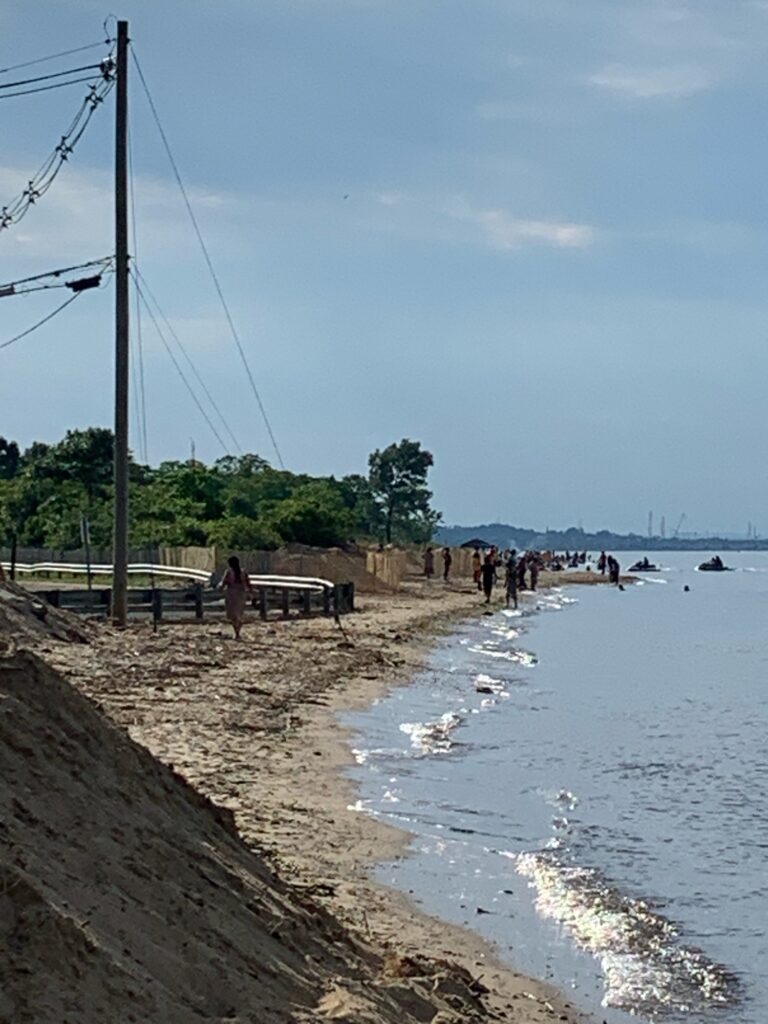a group of people walking on a beach (MyCoast AI)