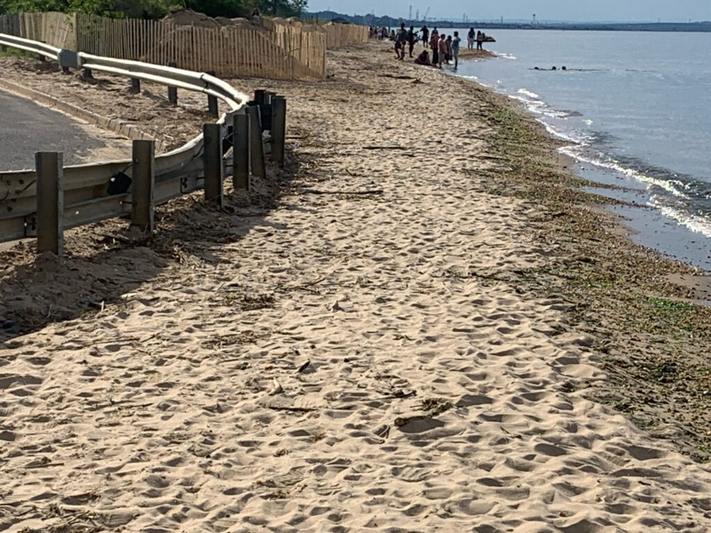 a beach with people walking on it (MyCoast AI)