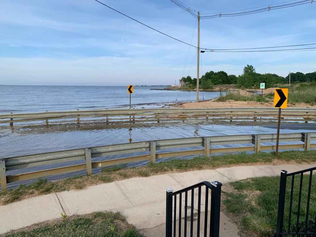 a beach with a fence and a body of water (MyCoast AI)