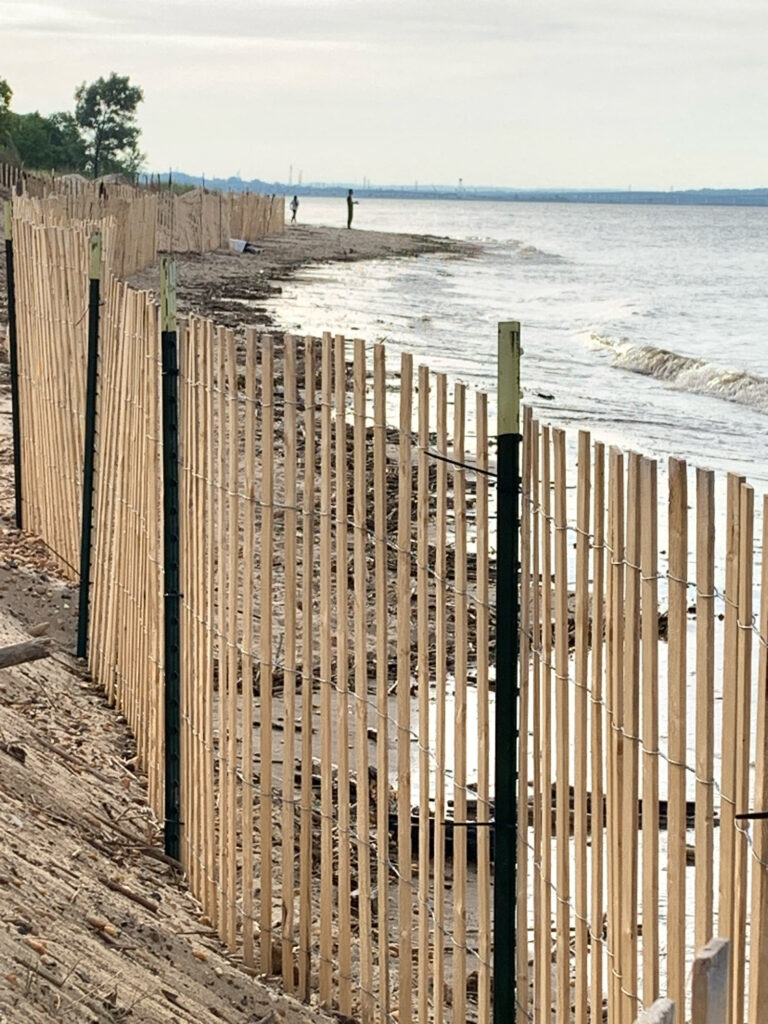 a fence in front of a beach (MyCoast AI)