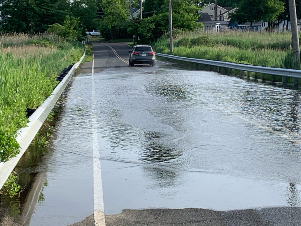 a car driving through a flooded road (MyCoast AI)