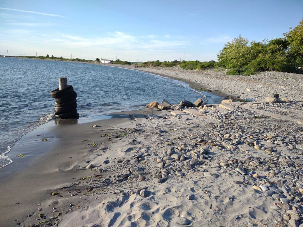a rocky beach with a pipe (MyCoast AI)