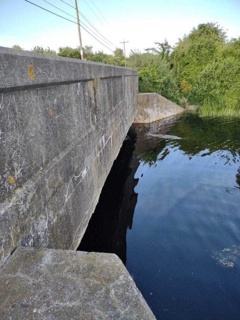 a dam with a river running through it (MyCoast AI)