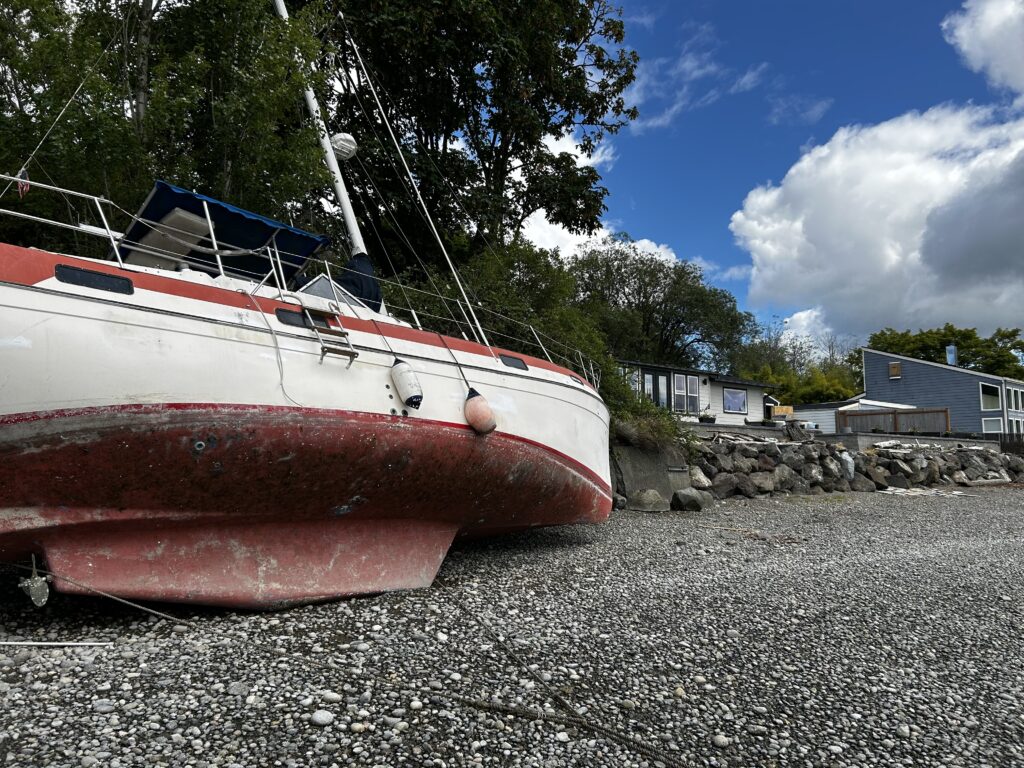 a boat on a rocky beach (MyCoast AI)