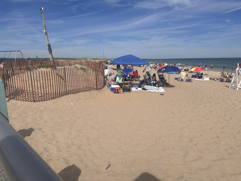 a sandy beach with umbrellas (MyCoast AI)