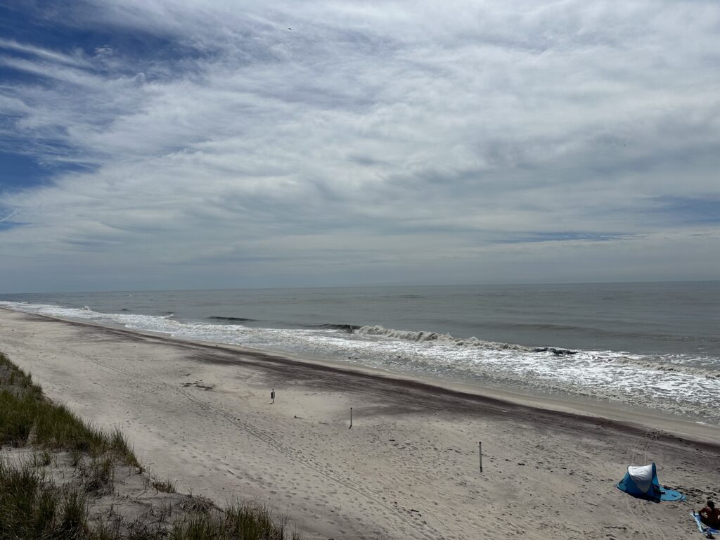 a beach with waves crashing on it (MyCoast AI)