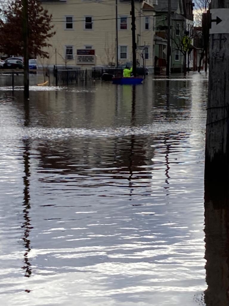 a flooded street with buildings and trees (MyCoast AI)