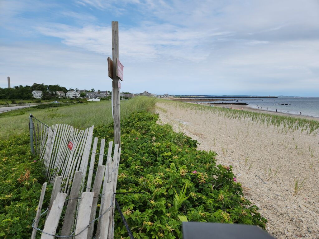 a wooden fence on a beach (MyCoast AI)