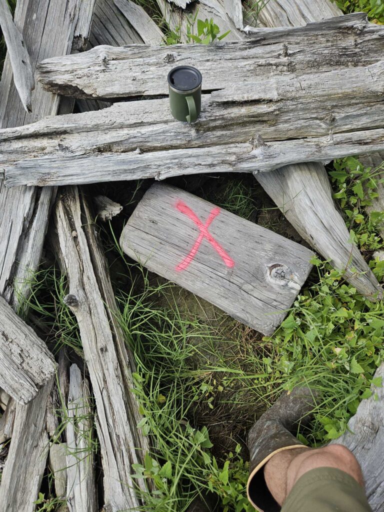 a wooden fence with a sign on it (MyCoast AI)
