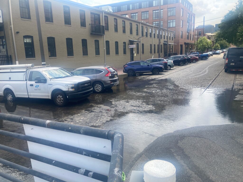 a parking lot with cars and buildings (MyCoast AI)