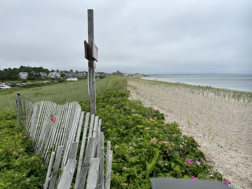 a wooden fence on a beach (MyCoast AI)