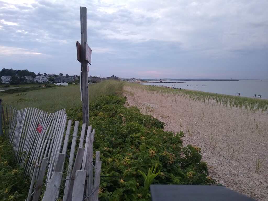 a wooden fence on a beach (MyCoast AI)