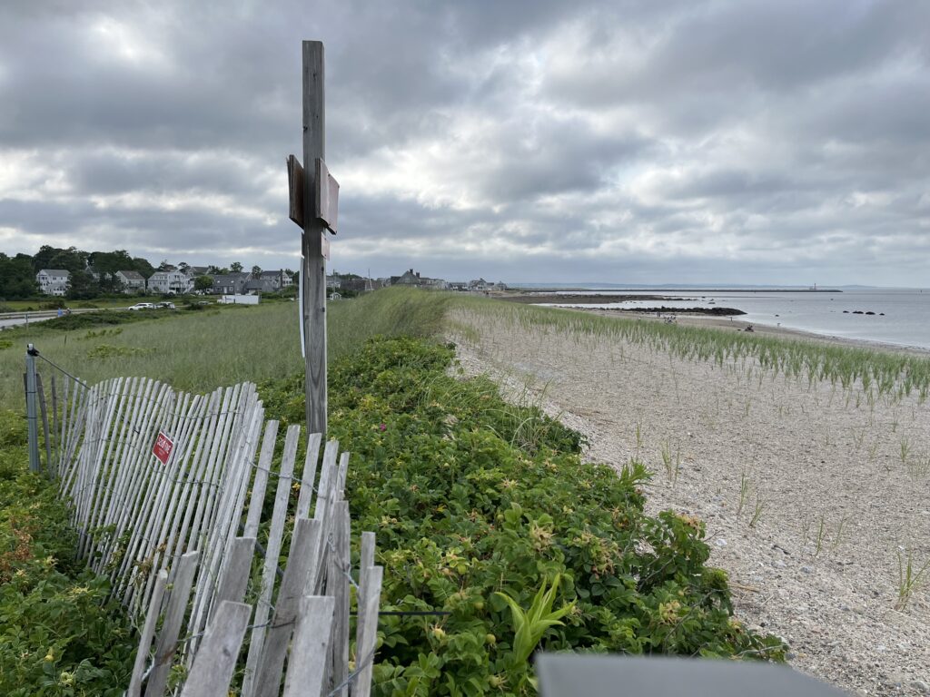 a wooden fence on a beach (MyCoast AI)