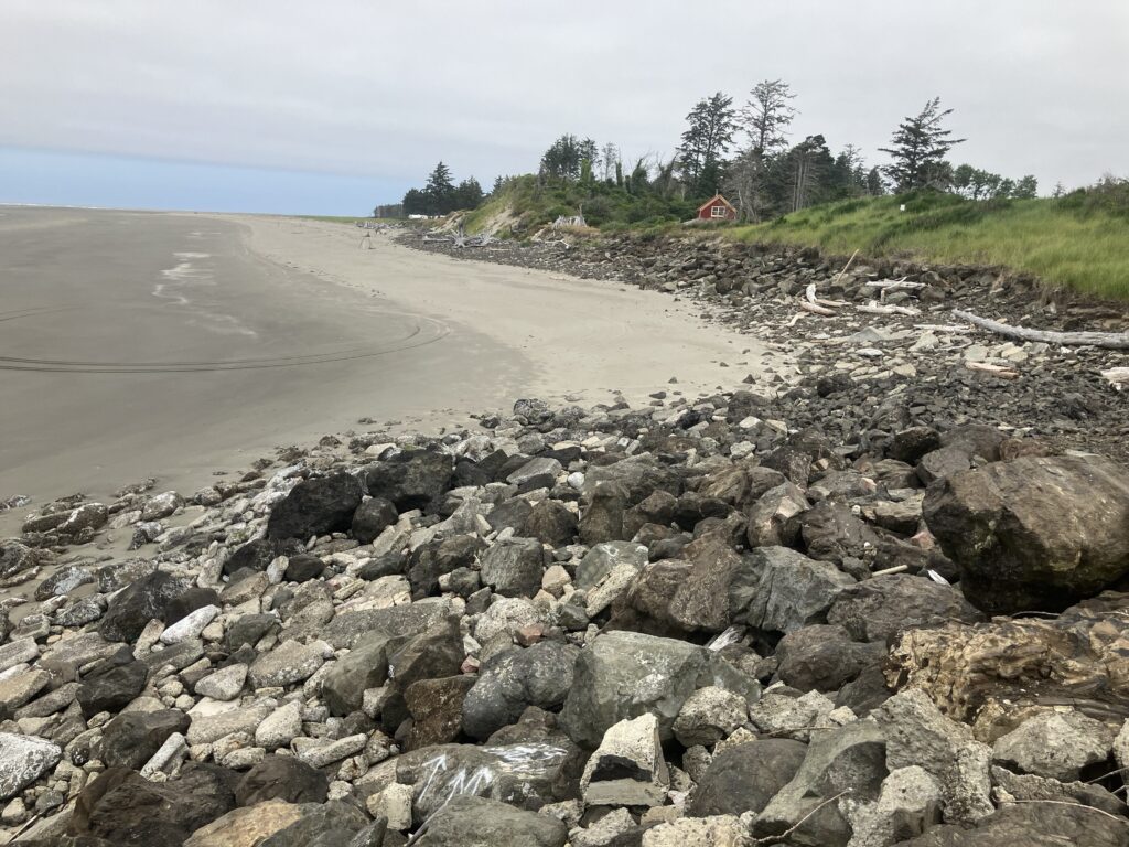 a rocky beach with a road (MyCoast AI)