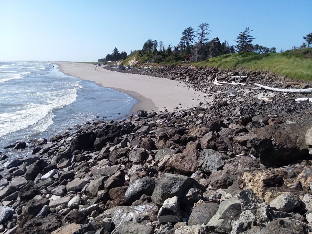 a rocky beach with a sandy beach (MyCoast AI)