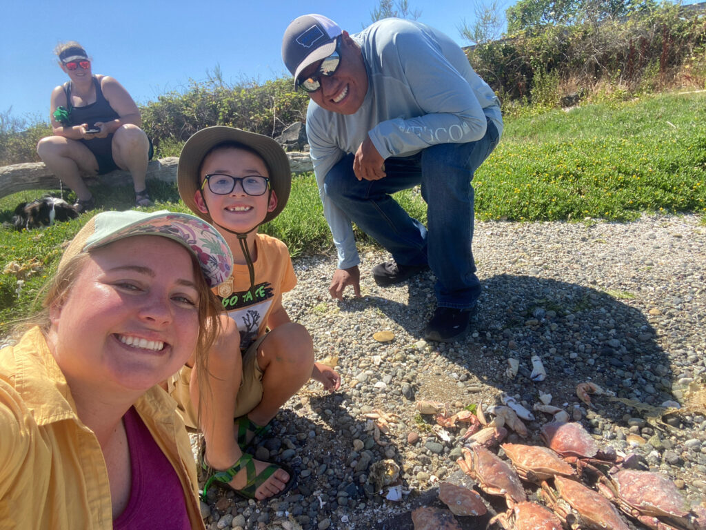 a group of people sitting on rocks (MyCoast AI)