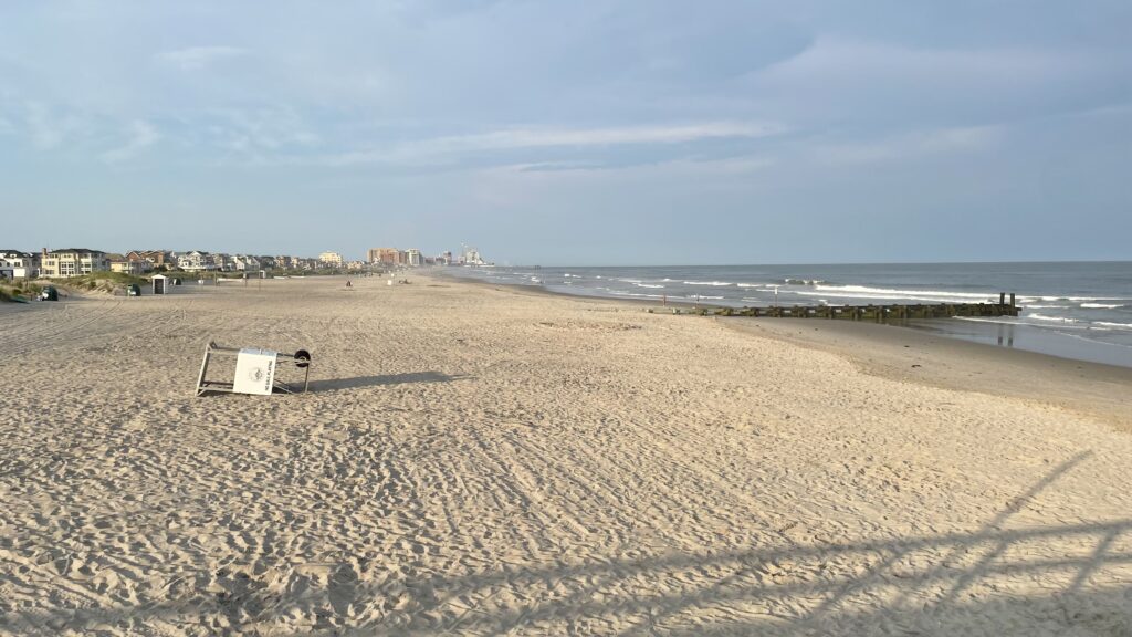a sign on a beach (MyCoast AI)