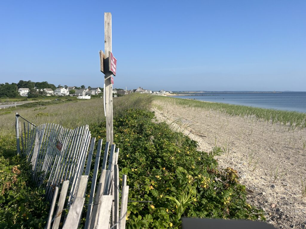 a wooden fence on a beach (MyCoast AI)
