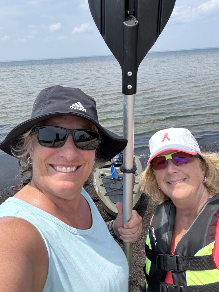 a couple of women on a boat (MyCoast AI)