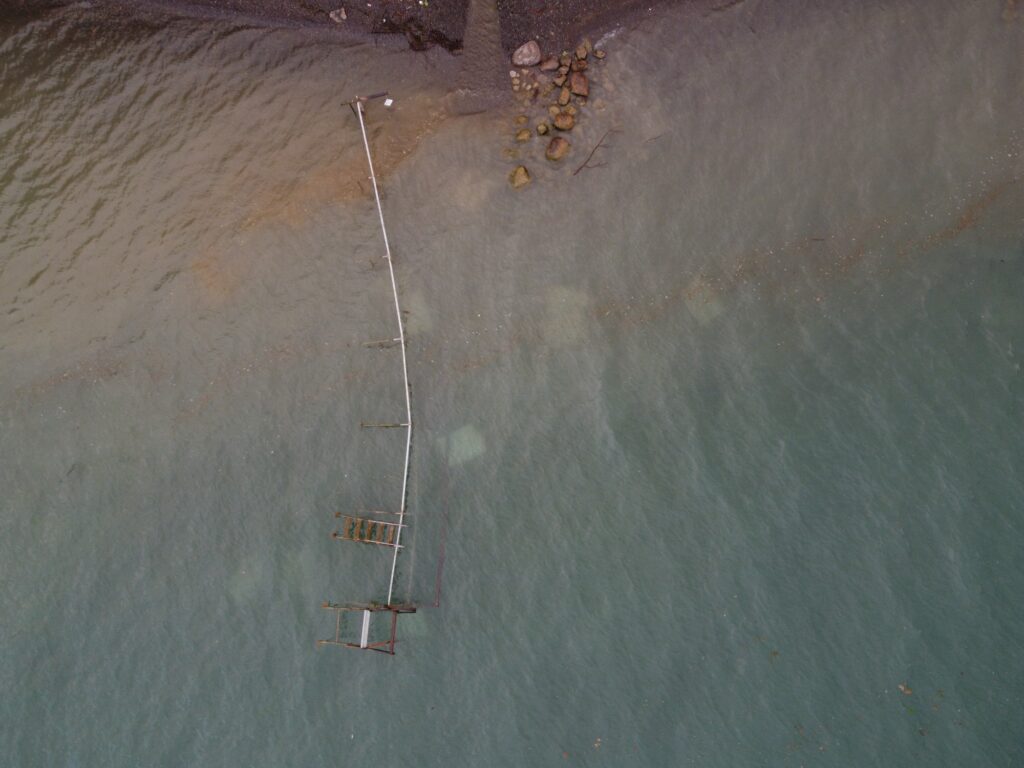 a ladder in a muddy area (MyCoast AI)