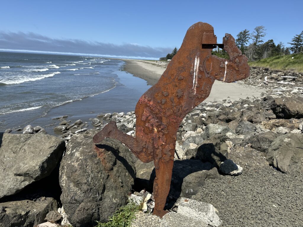 a large rock on a beach (MyCoast AI)
