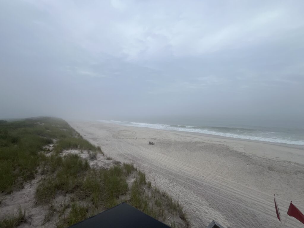 a beach with a tent (MyCoast AI)