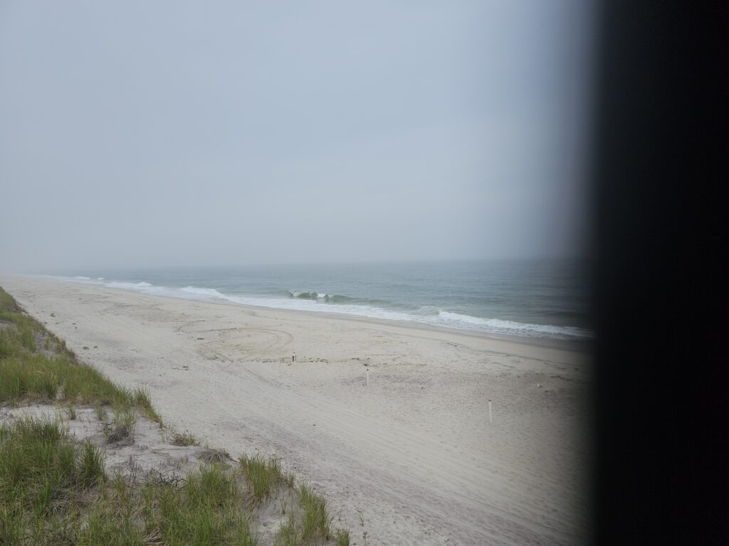 a beach with waves crashing on it (MyCoast AI)