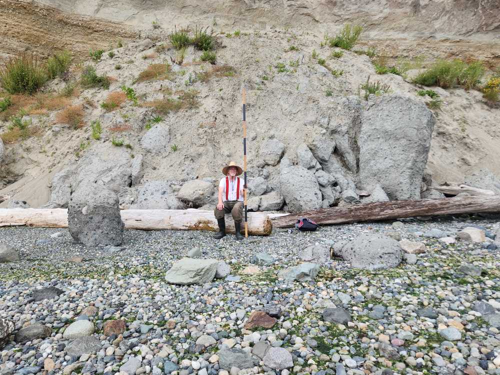a person sitting on a rock (MyCoast AI)
