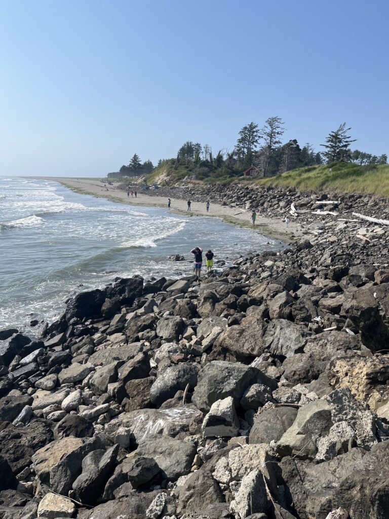 people walking on a rocky beach (MyCoast AI)