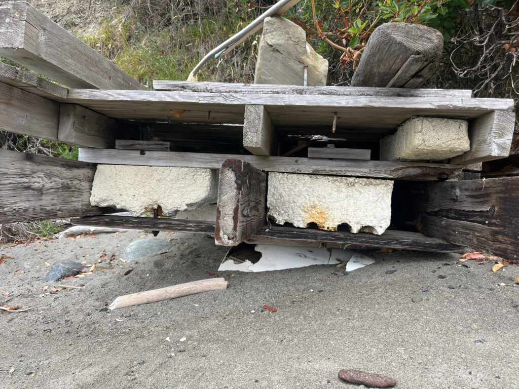 a wooden structure with a pipe (MyCoast AI)