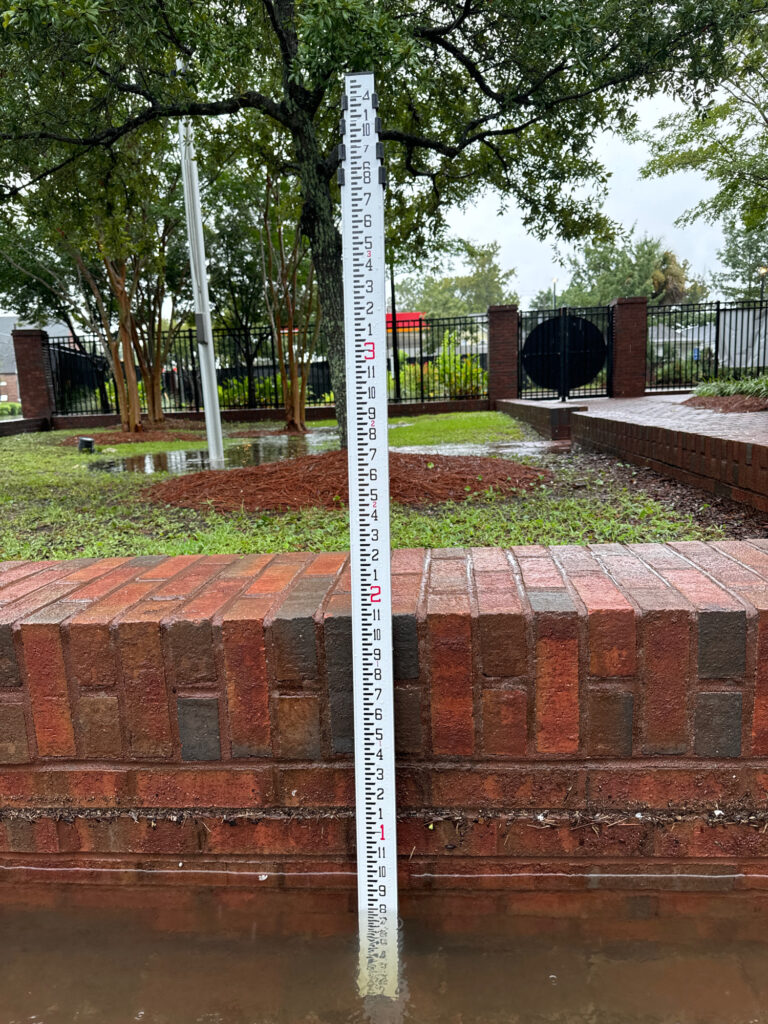 a sign on a brick wall (MyCoast AI)