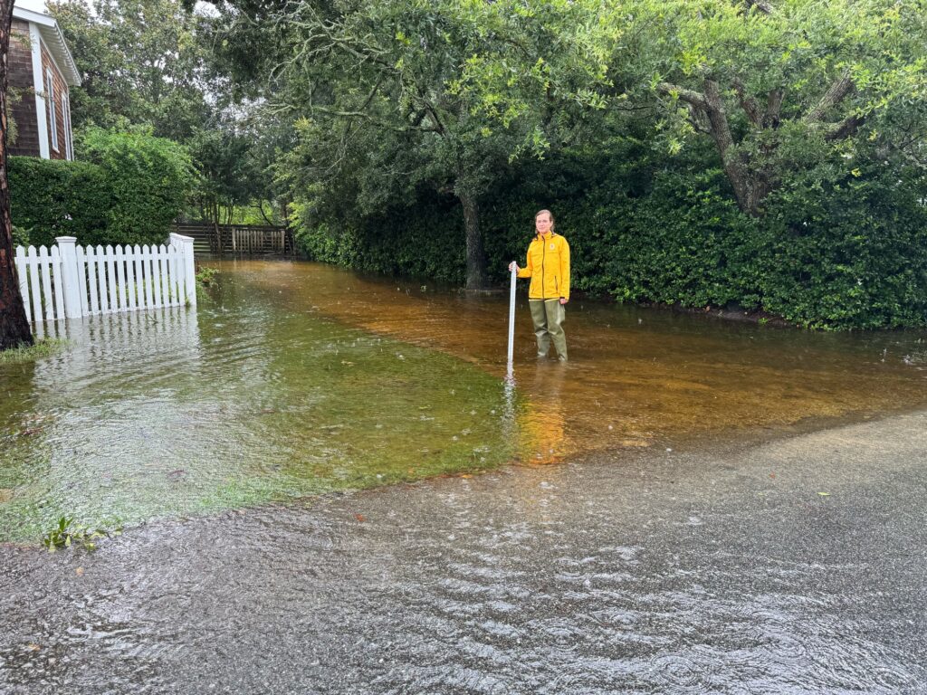 a person standing in a flooded street (MyCoast AI)