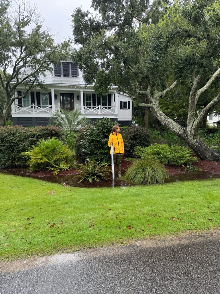 a person standing in a yard (MyCoast AI)