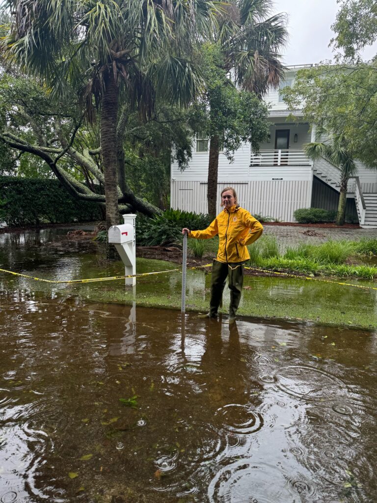 a man standing in a flooded street (MyCoast AI)
