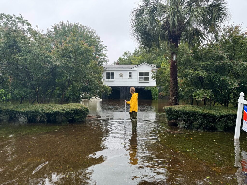 a boy standing in a flooded area (MyCoast AI)
