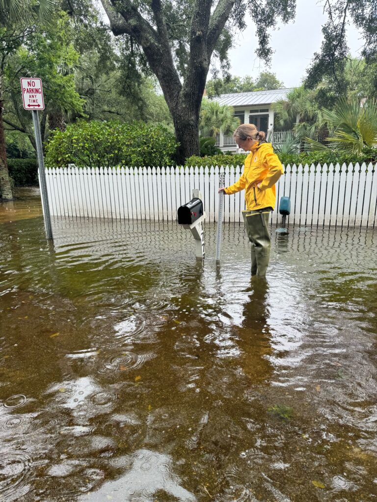 a man standing in a flooded street (MyCoast AI)