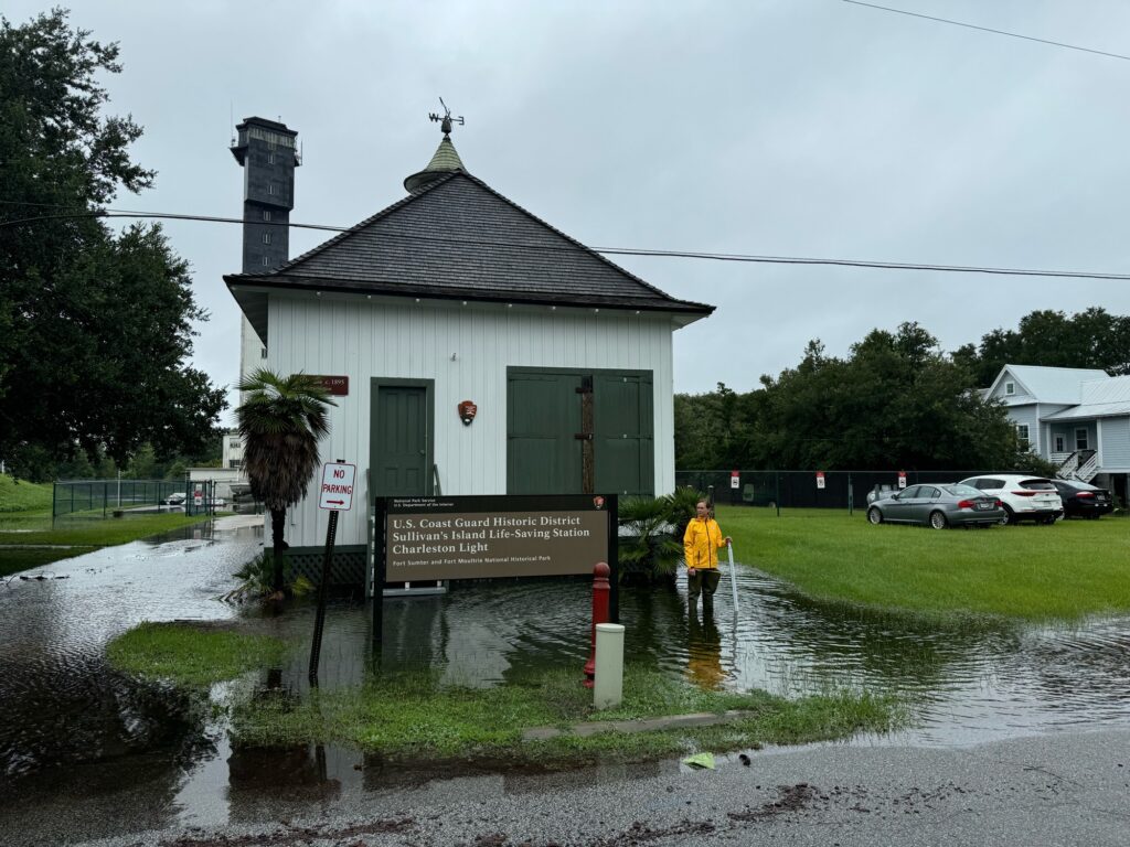 a person standing in a flooded street (MyCoast AI)