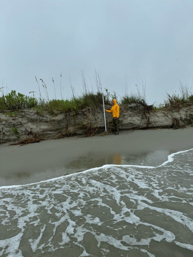 a person standing in a shallow river (MyCoast AI)