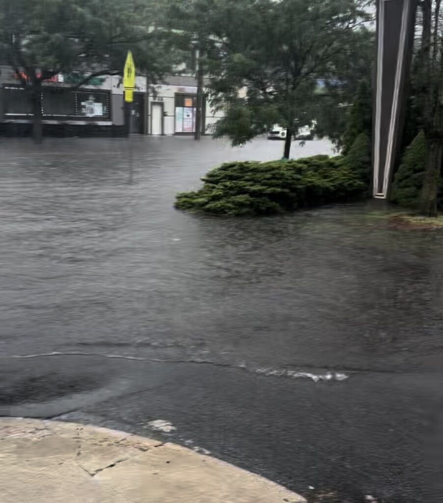 a flooded street with a building (MyCoast AI)