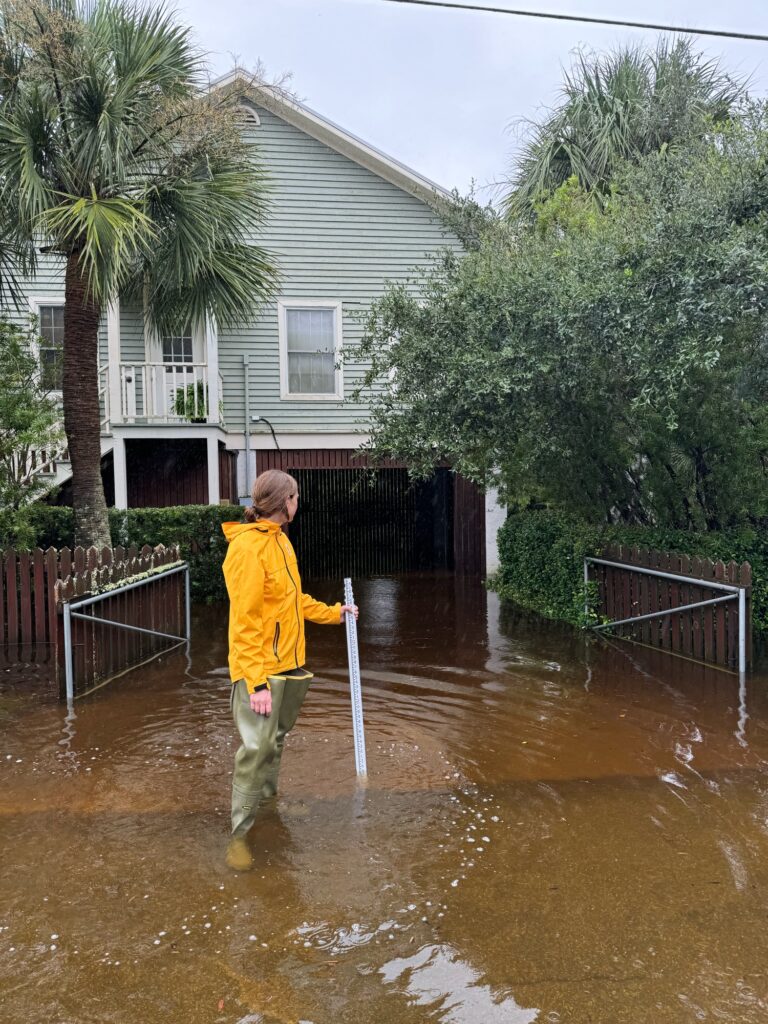 a person standing in a flooded street (MyCoast AI)