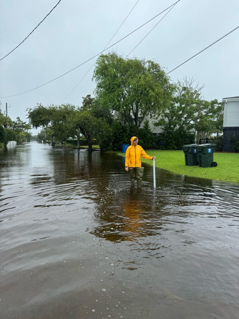 a person standing in a flooded area (MyCoast AI)