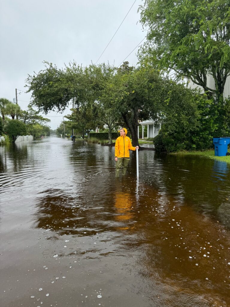 a person standing in a flooded street (MyCoast AI)