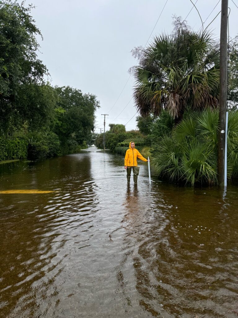 a person walking in a flooded street (MyCoast AI)