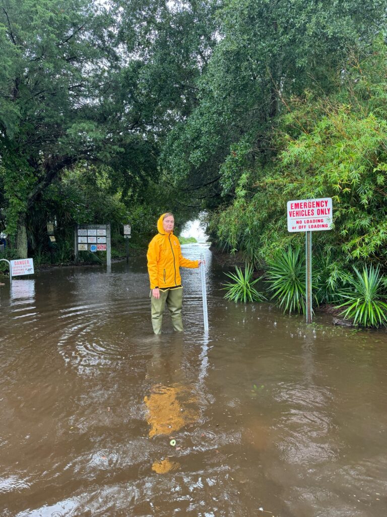 a man standing in a flooded area (MyCoast AI)