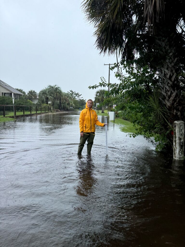 a person standing in a flooded street (MyCoast AI)