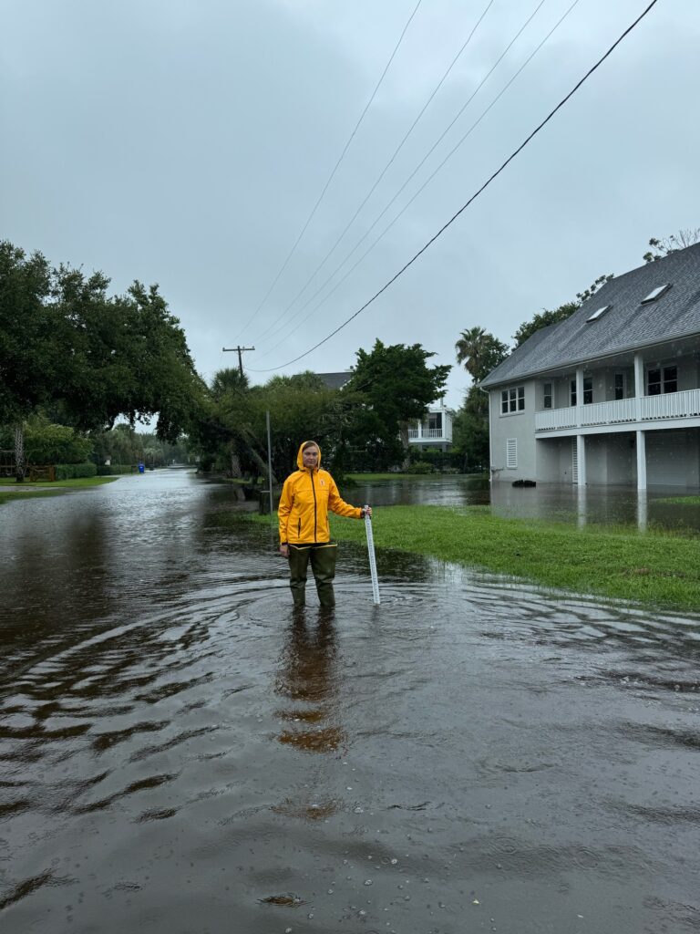 a person standing in a flooded street (MyCoast AI)