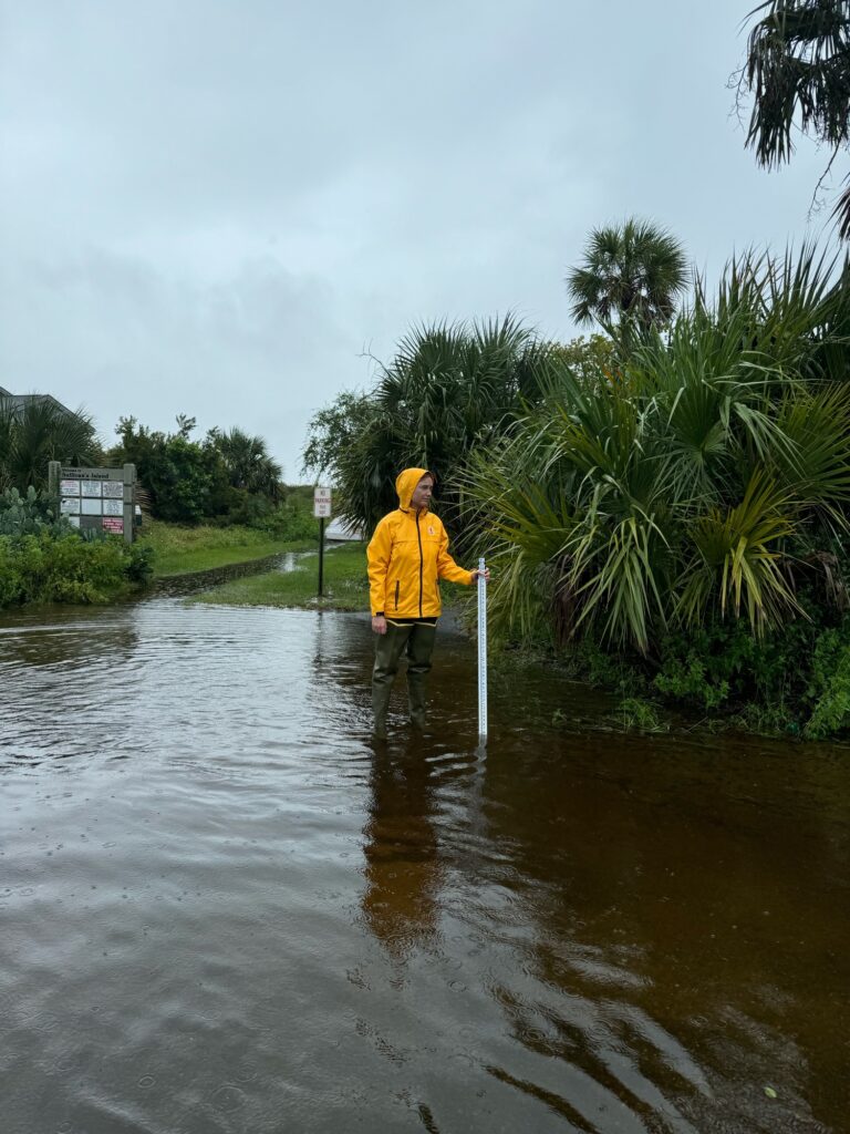 a person standing in a flooded area (MyCoast AI)