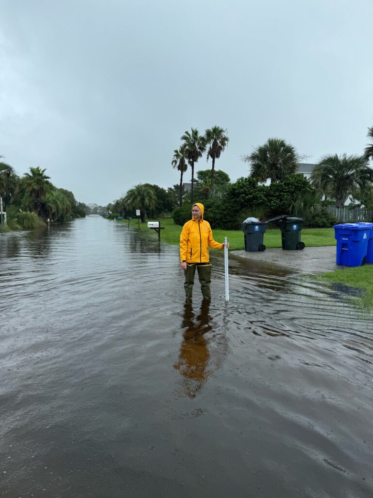 a person standing in a flooded area (MyCoast AI)