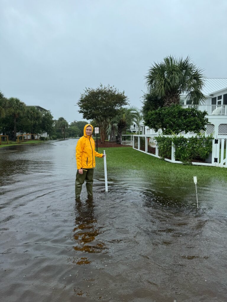 a person standing in a flooded street (MyCoast AI)